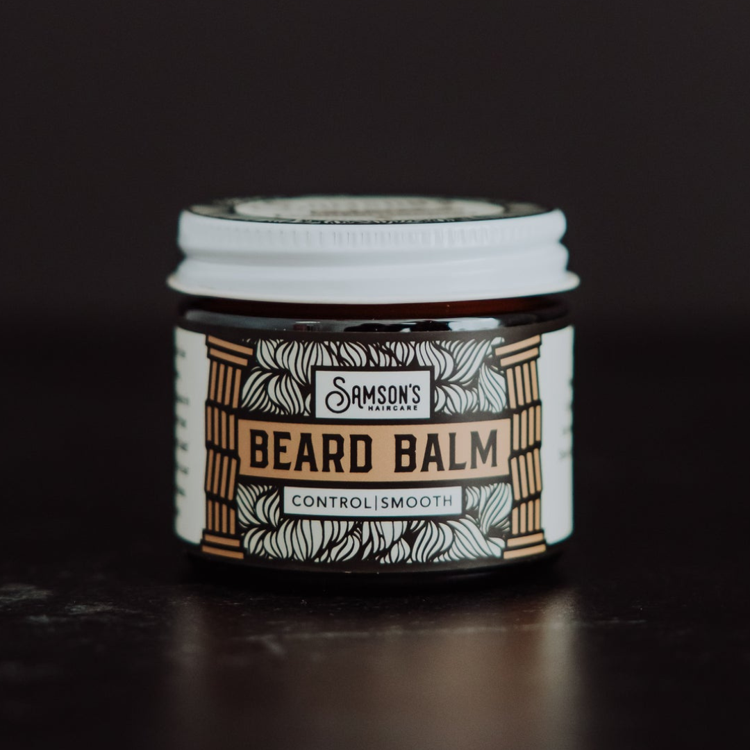 Samson's Haircare Beard Balm Original jar on a black background straight on view of the front of the brown jar with white lid