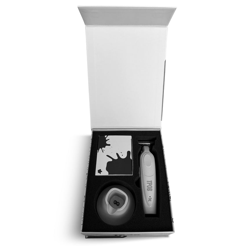 Trimmer and other items in a box on a white background