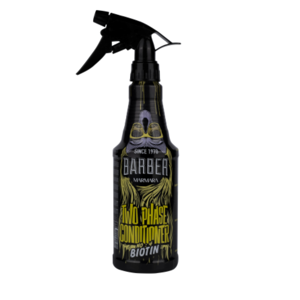A black trigger spray bottle of Barber Mama Two Phase Conditioner with Biotin, featuring a black spray trigger and a label with yellow and white text and graphics, isolated on a white background.
