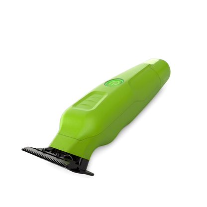 Green hair trimmer on a white background