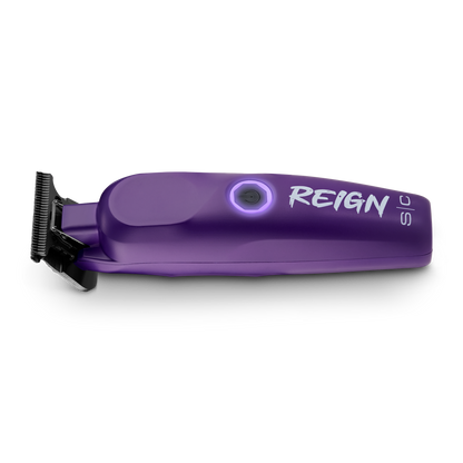 Purple hair trimmer with 'REIGN' branding on a white background