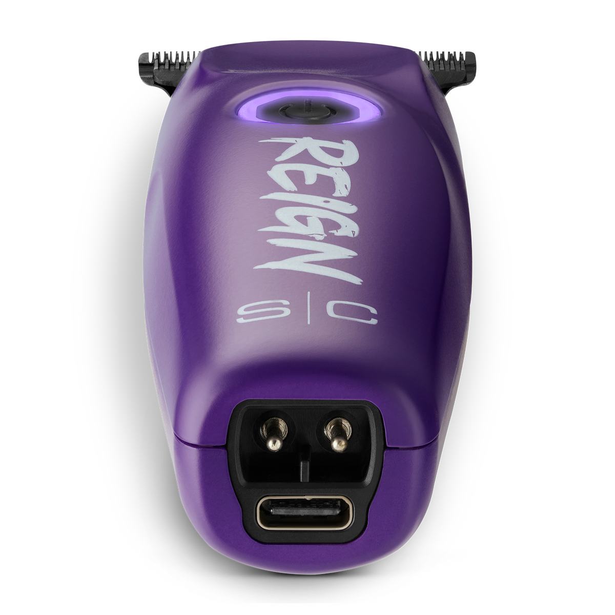 Purple grooming tool with 'REIGN s/c' branding on a white background