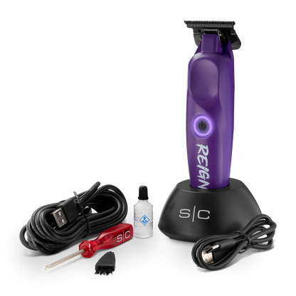 Purple hair trimmer with accessories on a white background