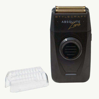 Stylecraft Absolute Zero electric shaver in black with gold trim, shown next to a clear protective cover on a light gray background.