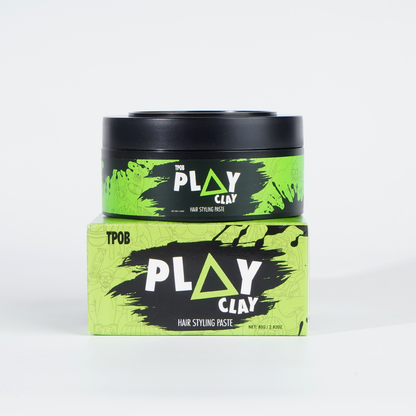 Play Clay hair styling paste with green and black packaging on a white background